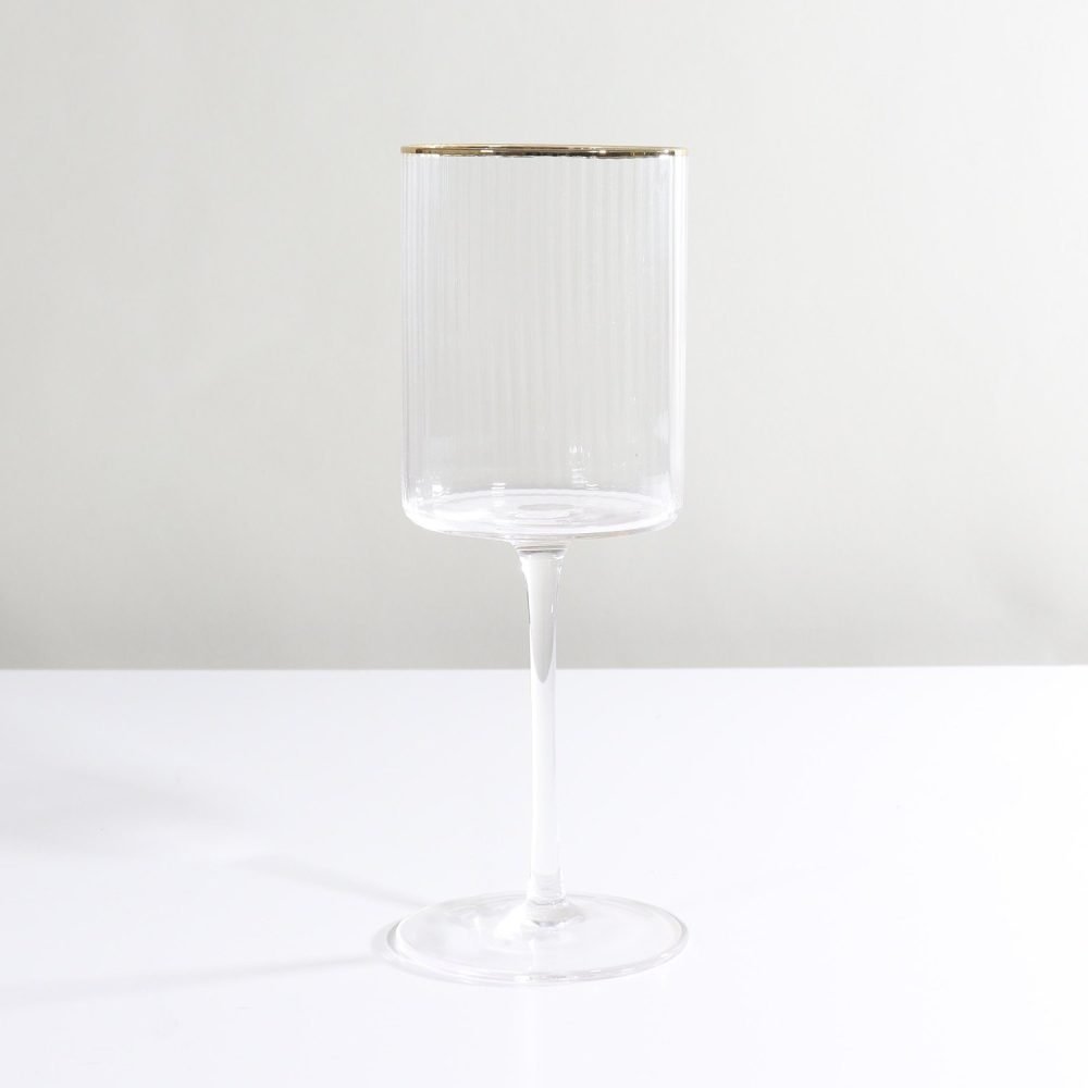 ribbed red wine glass with gold rim