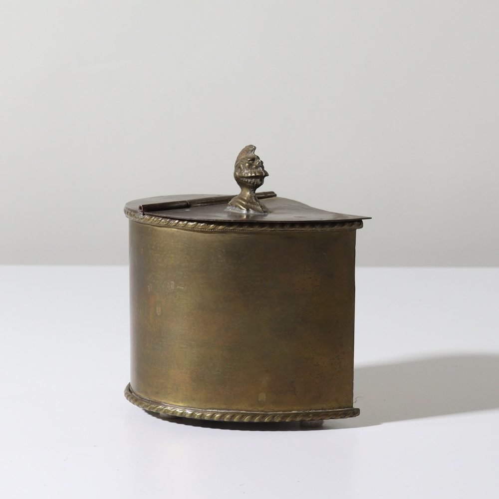 vintage brass asymmetrical teardrop container with lid and soldier knight helmet head knob
