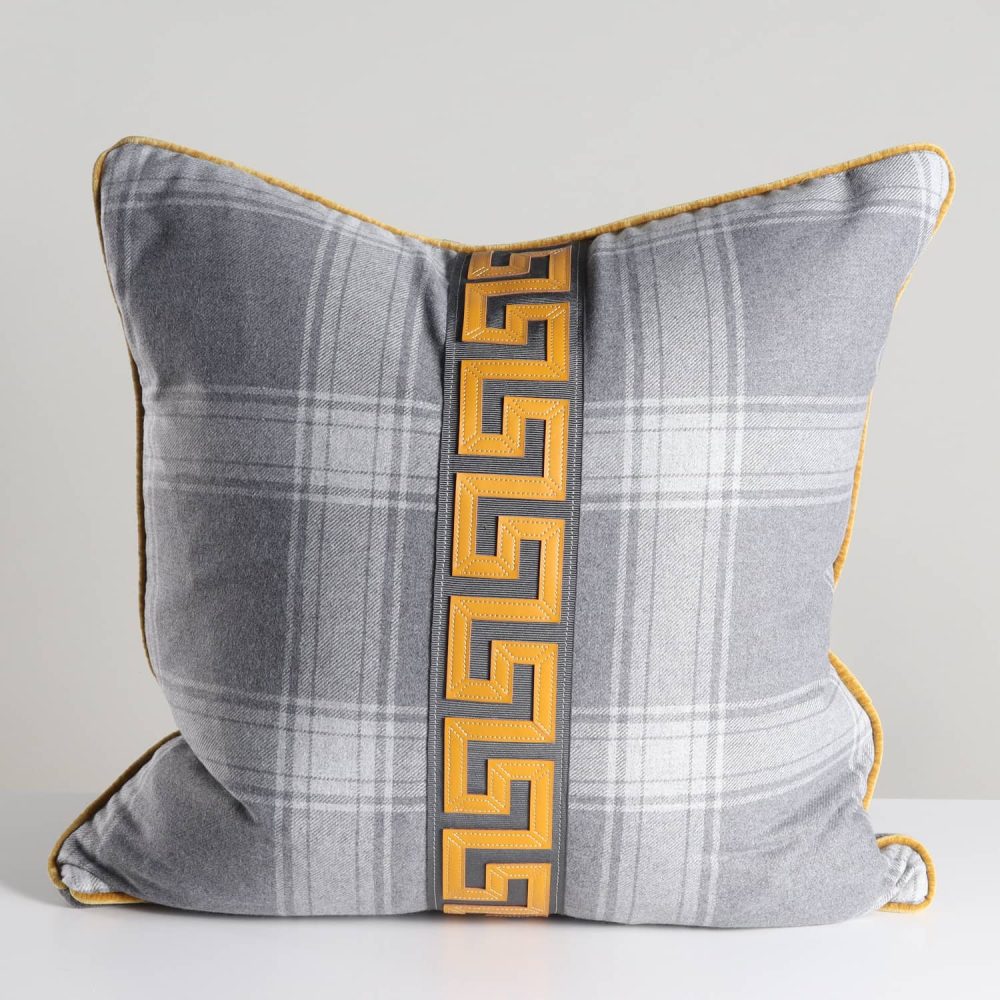 gray plaid pillow with mandarin orange greek key trim